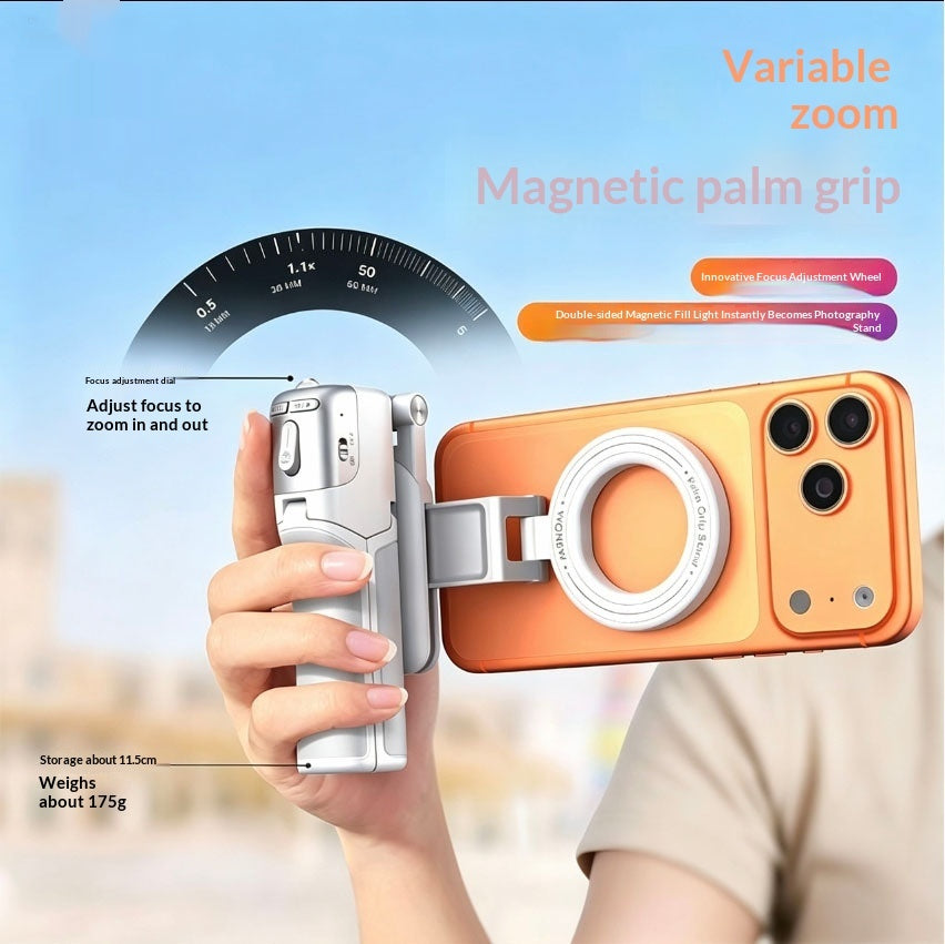 Z3 magnetic palm grip held in one hand with a phone attached, focus dial visible