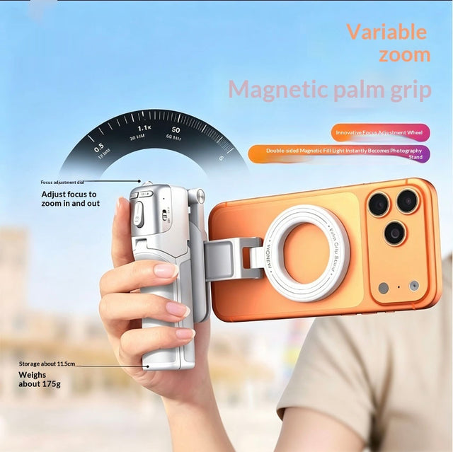 Z3 magnetic palm grip held in one hand with a phone attached, focus dial visible